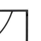Close-up of a black metal frame with a right angle and curved element, capturing the essence of modern abstract wall decor against a stark white background.