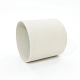 white-planter-oll-on -a-table