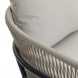 Close-up of a beige cushioned chair with Olefin fabric on the backrest, showcasing woven rope detailing. Perfect for a patio furniture set.