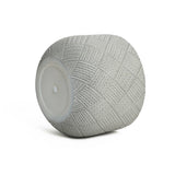 Gray, textured, cylindrical planter crafted from MgO material, featuring a herringbone pattern and a flat white circular end with a discreet drainage hole for optimal plant care.