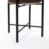 Close-up of a chair showcasing black metal legs and a dark wooden seat, crafting a unique dynamic visual effect against the white background—perfect for elevating any home decor.