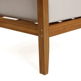 Close-up of an Outdoor Acacia Wood Armchair leg with two visible screws, supporting a light-colored cushioned seat on a white background.