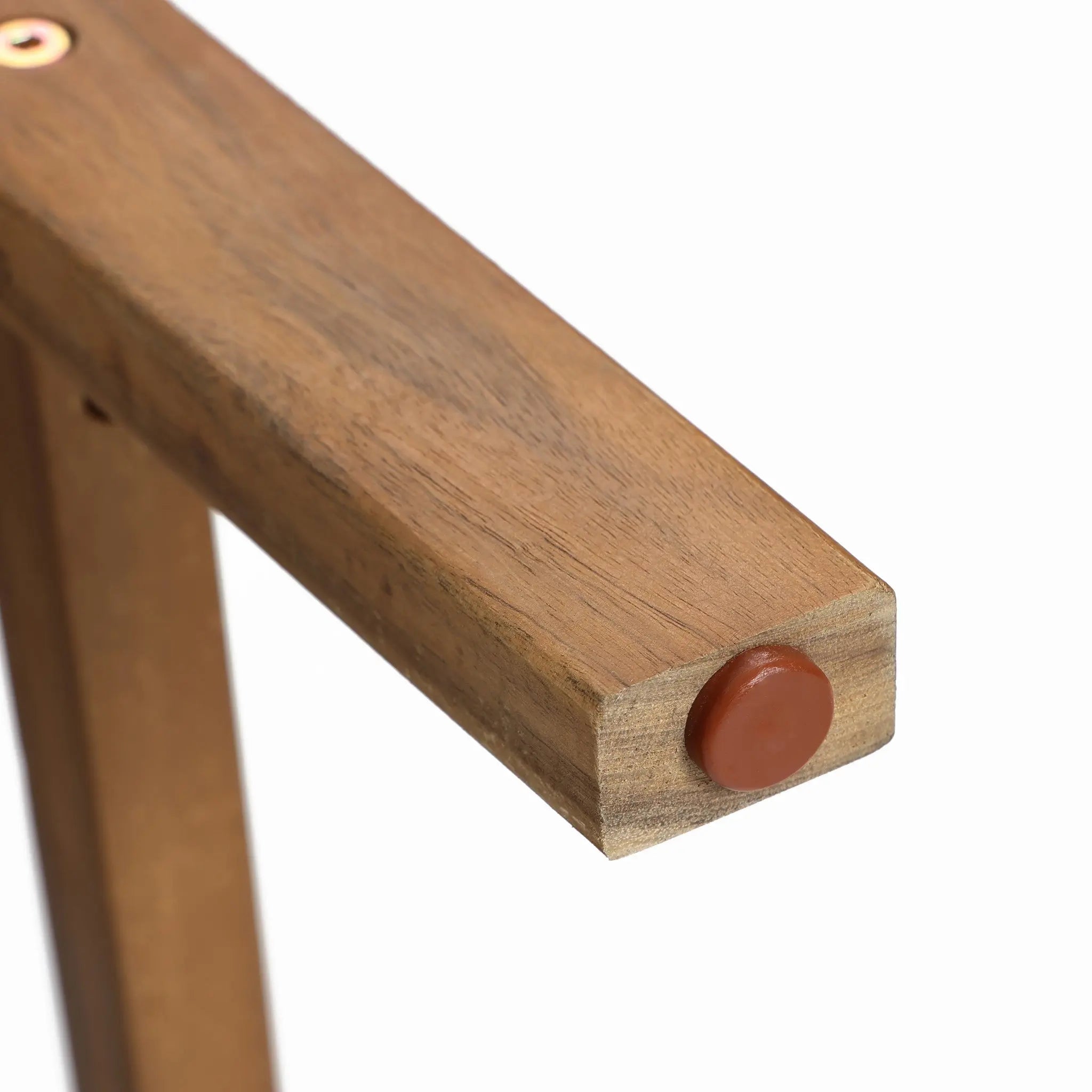 Close-up of an Acacia wood table leg with a hexagonal shape, featuring a round brown rubber foot at the bottom. Perfectly complements counter height stools or black rope-woven seats for a cohesive look.