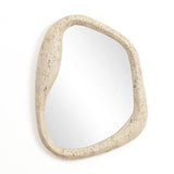 This home decor piece features an asymmetrical mirror with a natural, free-form frame, mounted on a white wall.