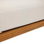 Close-up of a white upholstered cushion resting on an Outdoor Acacia Wood frame, likely part of Club-Style Patio Furniture or a Rope Sides Loveseat.