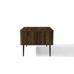 Rectangular wood coffee table with rounded edges and black metal legs, showcasing a mid-century modern design, photographed against a plain white background.