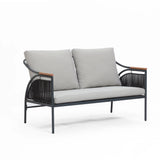 This modern two-seater sofa features gray, removable waterproof cushions and a black metal frame accented with wooden armrests. Designed for versatility, it seamlessly transforms from an indoor piece to part of an outdoor seating set.