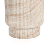 Close-up of a textured, cylindrical stone column with horizontal grooves and a sand-colored pattern, reminiscent of travertine-style side table designs that effortlessly complement both indoor and outdoor aesthetics.