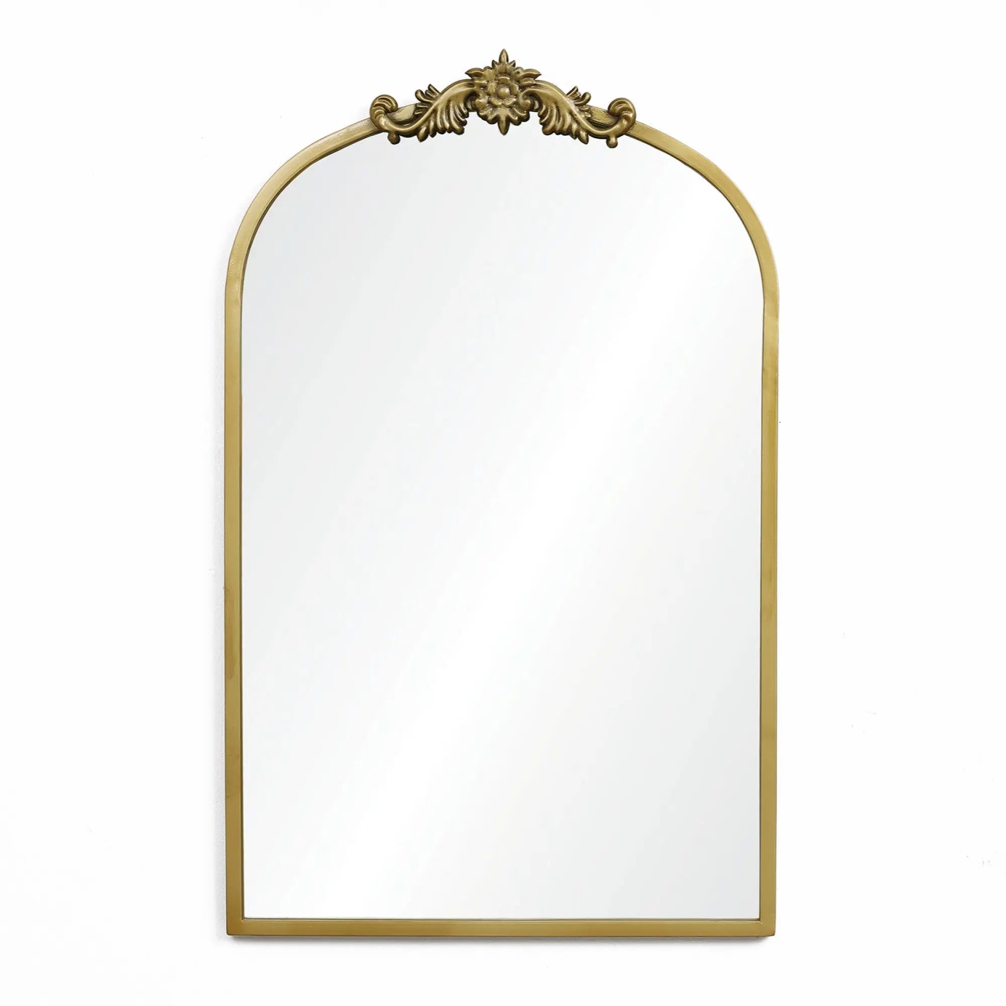 The Rêverie vintage gold accent metal frame arch mirror from LuxenHome features intricate floral detailing and resembles an elegant arched window silhouette, perfectly set against a plain white background.