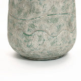 A close-up of the LuxenHome Rustic Multi-Color Cement 14-Inch Round Planter features wavy, raised patterns. Its light grey with green accents on ridges elevates the intricate design, set against a plain white background for emphasis.