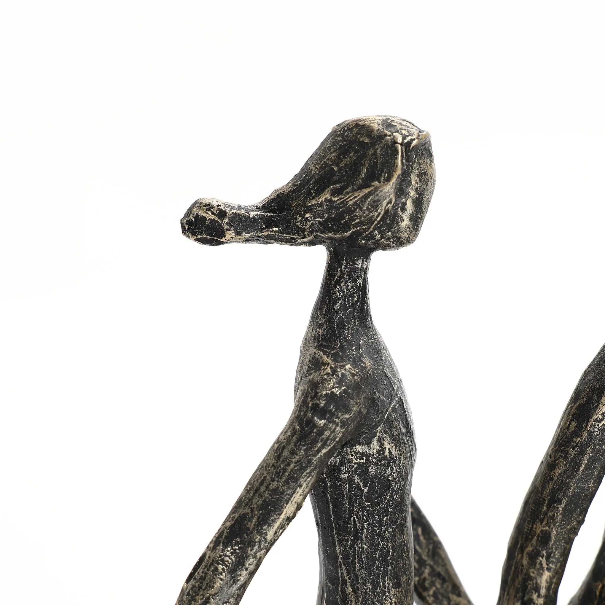 A black, abstract sculpture, crafted from modern resin, features a humanoid figure with an elongated snout-like head against a white background—a striking home decoration piece.