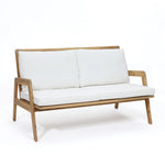 white-loveseat-with-a-wooden-frame-and-white-cushions