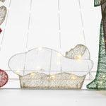 A wireframe nativity scene featuring a glowing baby Jesus figure illuminated by small LED bulbs, set against a white background. This enchanting Christmas decoration is beautifully complemented by the radiant presence of the North Star.
