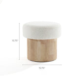 Discover the Mina Boucle and Wood Storage Ottoman by LuxenHome, a modern upholstered footstool featuring a round cushioned top in white fabric atop a wooden cylindrical base with vertical grooves. Dimensions: 15.75” H x 15.75” D, combining style and functionality effortlessly.