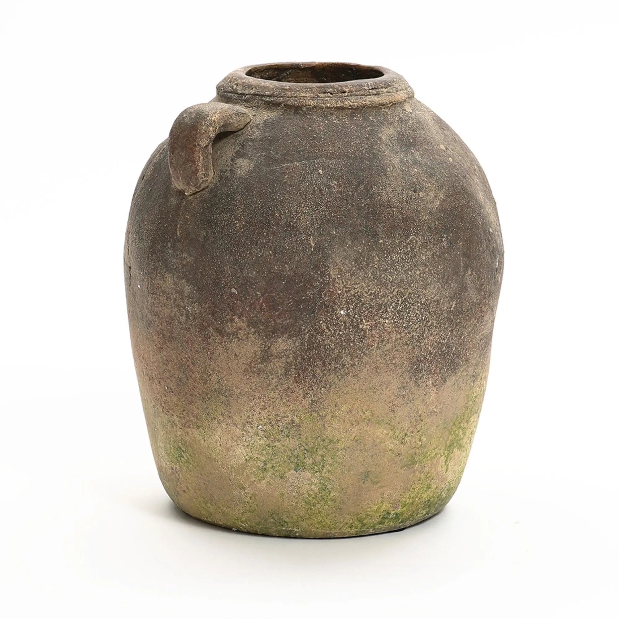 An aged, round clay jar with a small spout and weathered surface, showing signs of moss and wear, this rustic terracotta vase embodies a handcrafted, weathered finish suitable for both indoor and outdoor display.