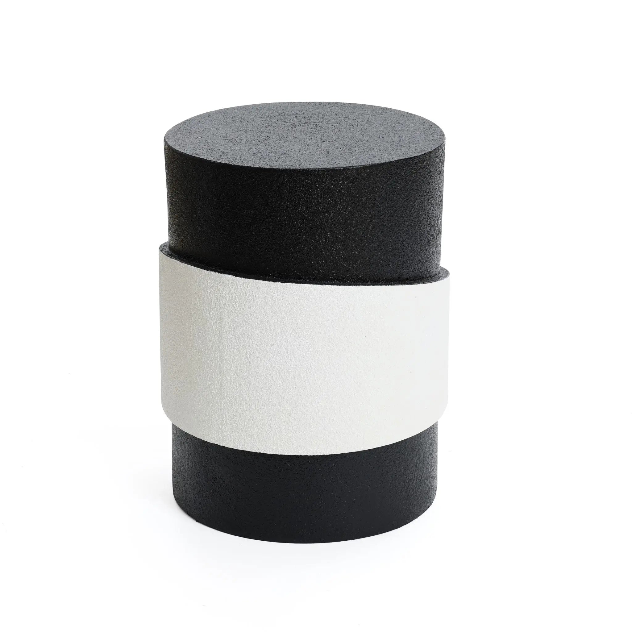 A cylindrical black object with a unique white irregular pattern wrapped around the middle, set against a plain white background.