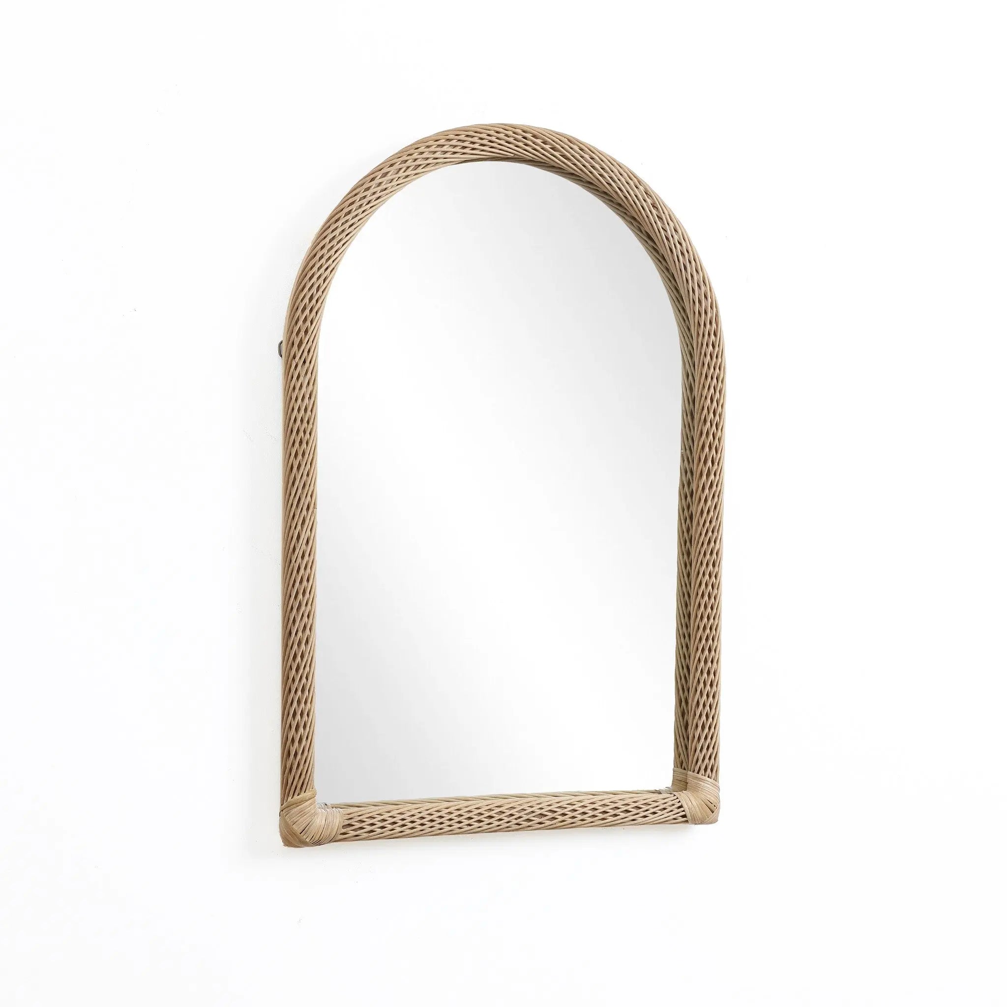 This decorative hanging mirror features an arched rectangular design with a rattan frame, beautifully reflecting a blank white background.