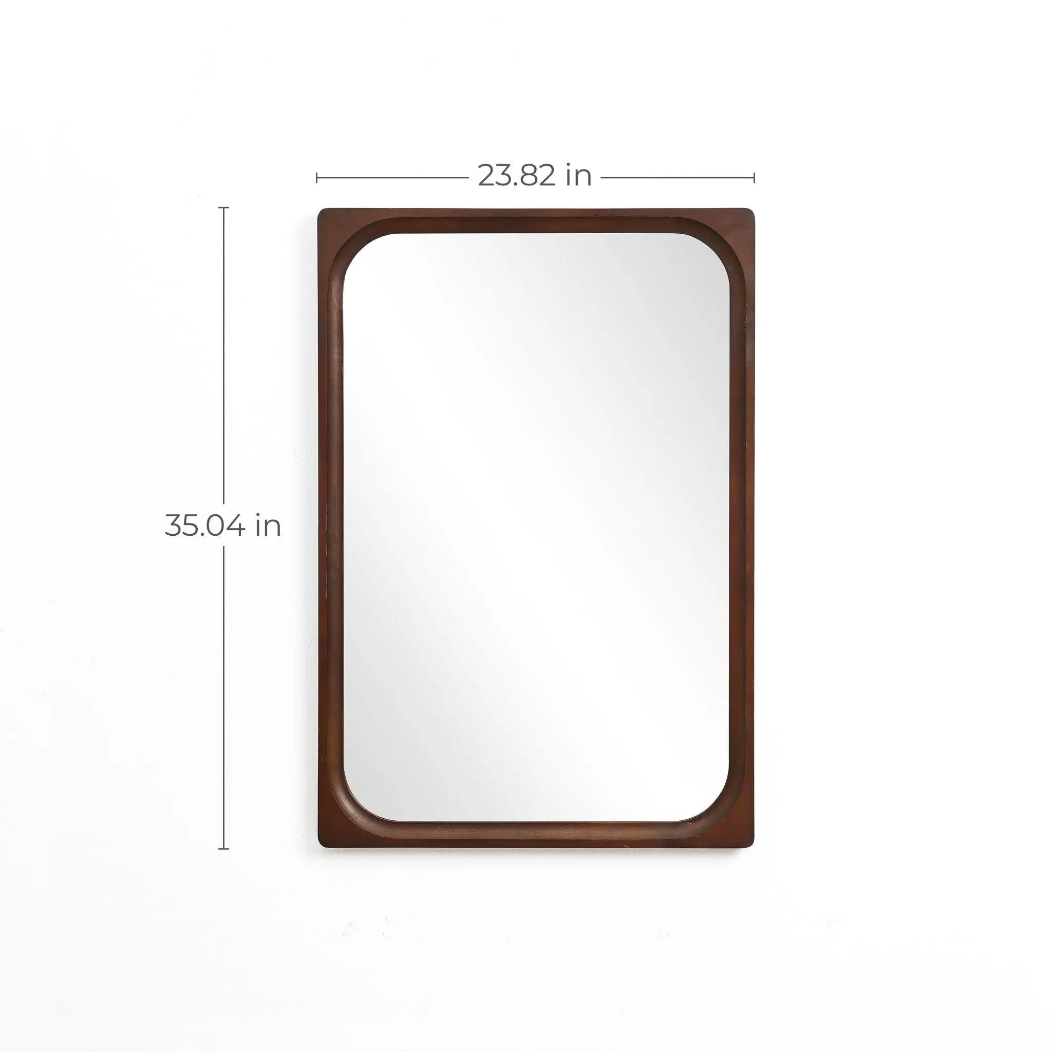 Elevate your home decor with this elegant wall mirror, featuring a rectangular rubberwood frame. It rests gracefully on a white wall, measuring 23.82 inches wide and 35.04 inches tall, adding timeless style to any space.
