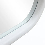 Close-up of a curved, light grey, textured surface with a C-shaped silhouette, possibly part of a modern architectural structure or furniture piece, set against a white background.