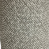 Close-up of a textured surface featuring a pattern of interwoven diamond shapes formed by intricately braided grey rope, reminiscent of the sleek lines found in modern minimalist design.