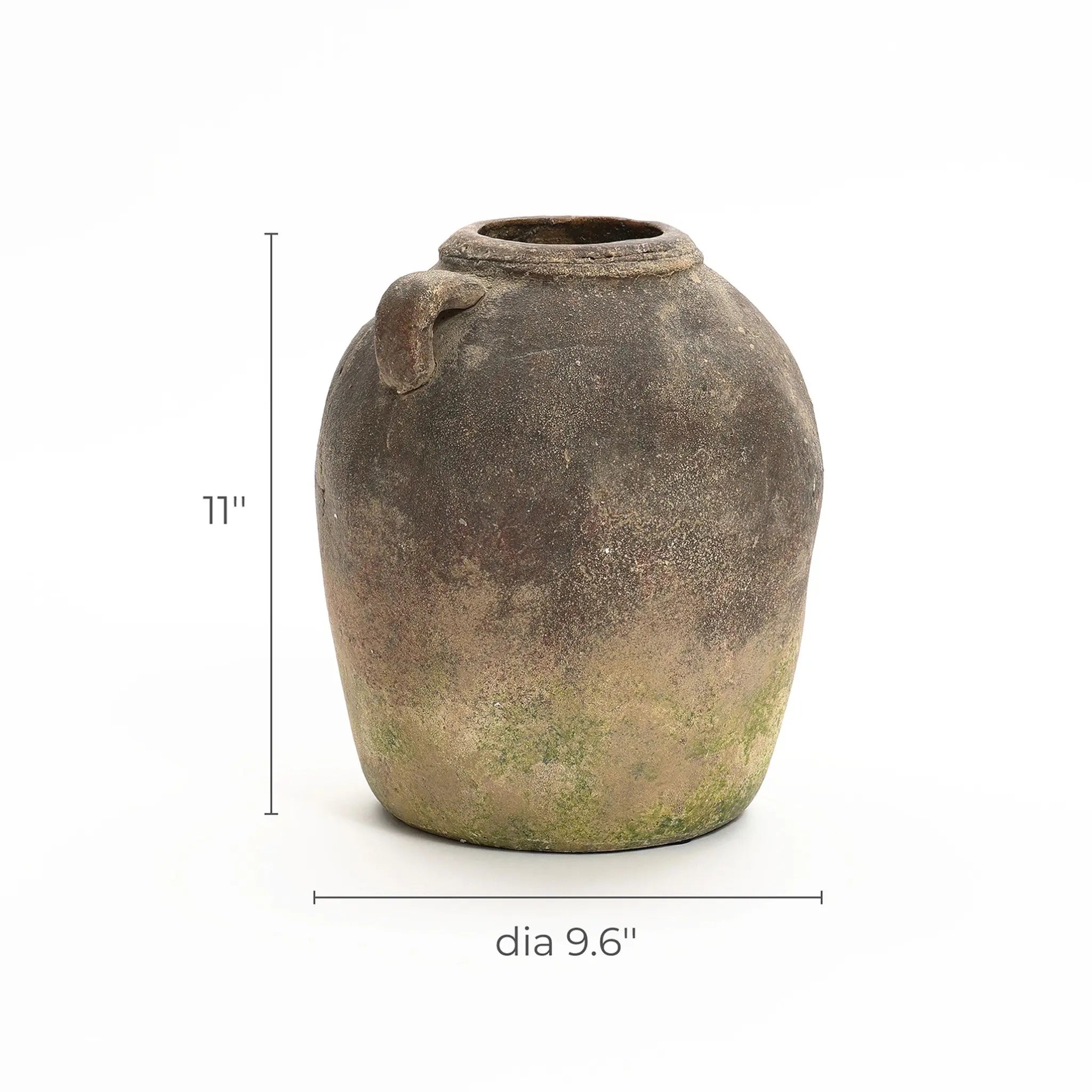 A rustic terracotta vase with a single handle, measuring 11 inches in height and 9.6 inches in diameter, boasts a handcrafted weathered finish. Perfect as an indoor and outdoor urn, it adds timeless charm to any setting.