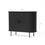 The LuxenHome Aria 2-door tambour accent cabinet features a sleek black finish with vertical grooves and minimalist handles in a mid-century modern style. It stands on four slender legs and measures 35.4 inches wide, 15.7 inches deep, and 29.5 inches high.