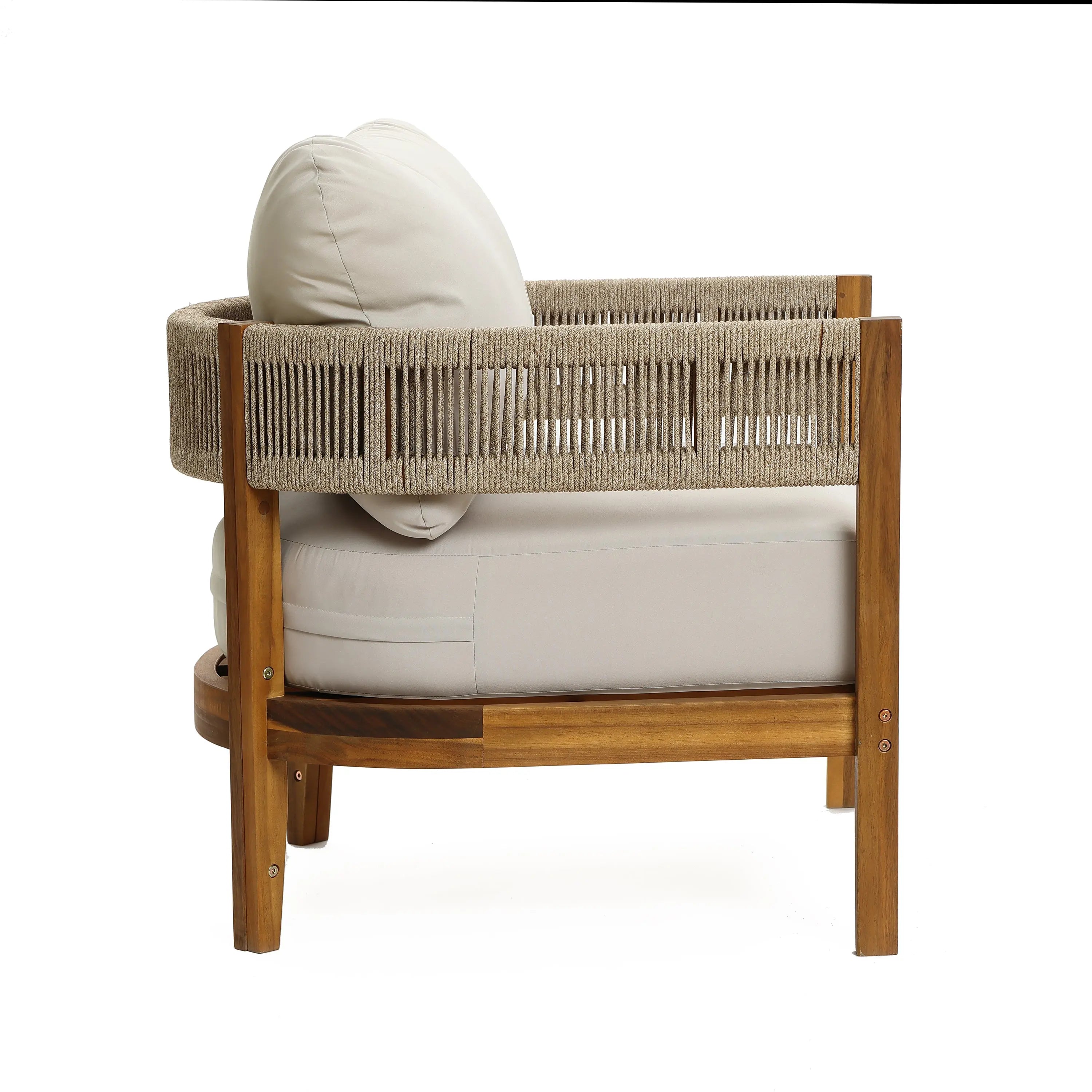 A Rope Sides Armchair crafted from acacia wood with weather-resistant beige cushions and a woven rope backrest, shown from the side against a white background.