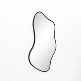 Modern minimalism shines through in this asymmetrical wall mirror, which boasts a sleek black frame against a crisp white background.