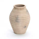 The LuxenHome Rustic Beige Ribbed Terracotta Urn Vase, 13.2 h, features a handcrafted look with a wide body and narrow opening. Its light beige color, ribbed texture, and traditional pottery vibe showcase slight color variations and imperfections that enhance its charm.