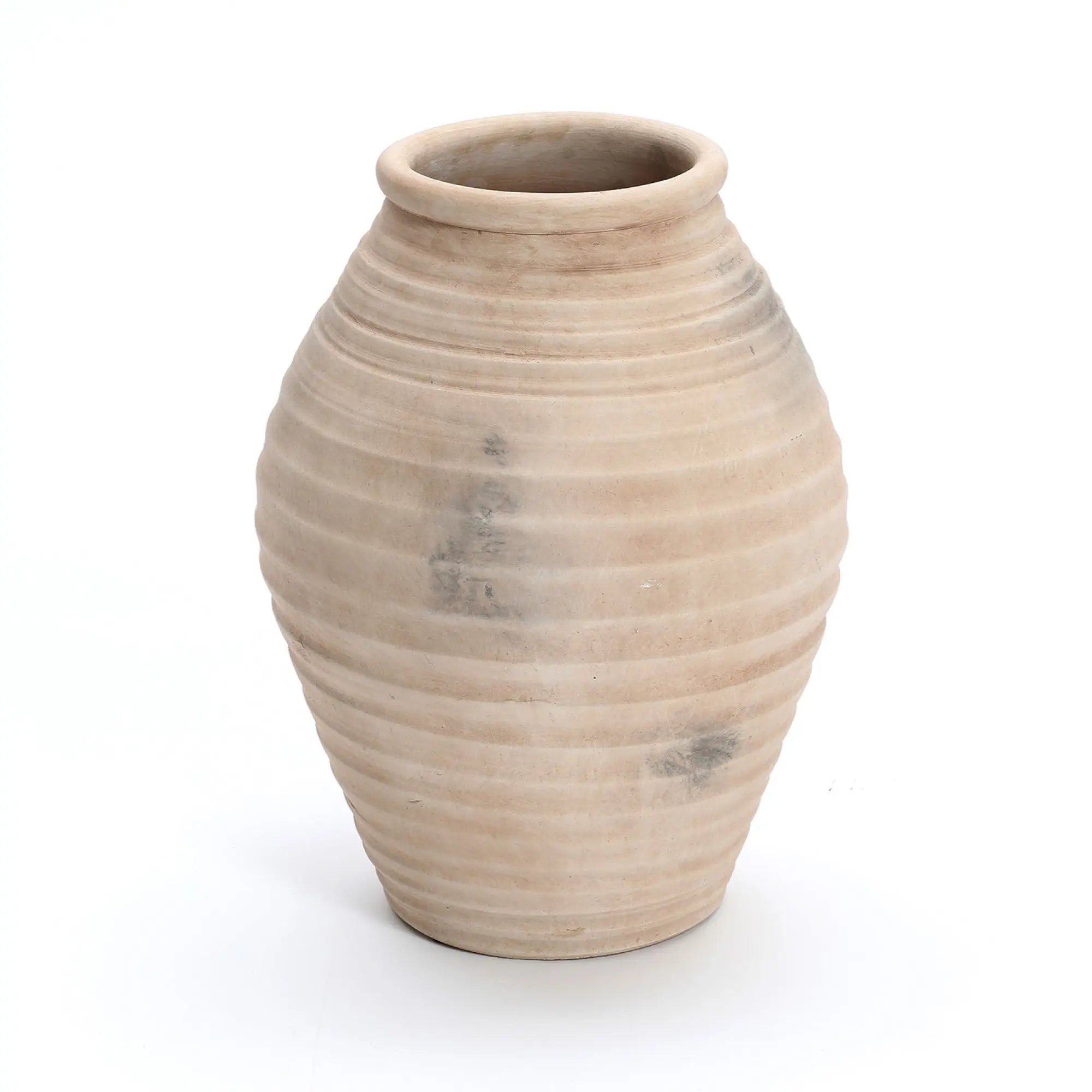 The LuxenHome Rustic Beige Ribbed Terracotta Urn Vase, 13.2 h, features a handcrafted look with a wide body and narrow opening. Its light beige color, ribbed texture, and traditional pottery vibe showcase slight color variations and imperfections that enhance its charm.