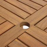 Close-up of a wooden table surface with a slatted design and a circular hole in the center, crafted from FSC-certified acacia wood.