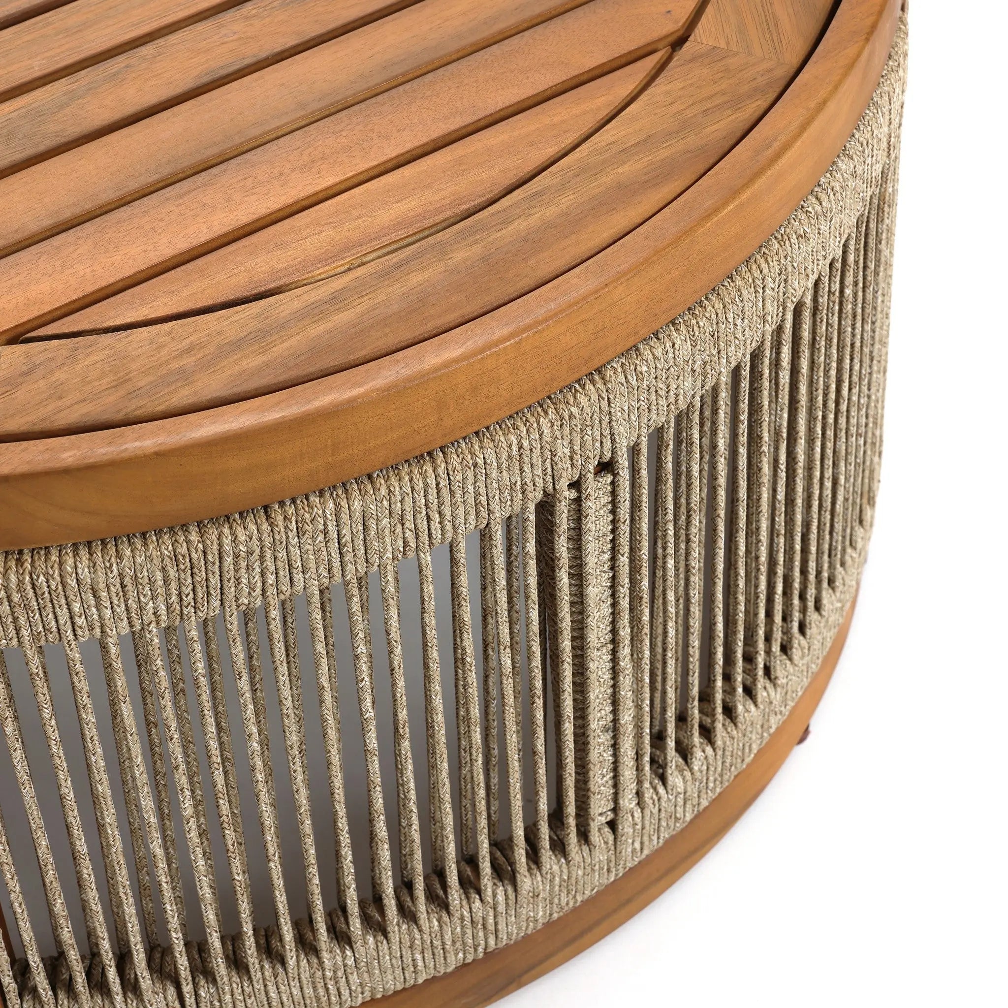 Close-up of a round table crafted from acacia wood, featuring a slatted top and hand-woven rope sides, set against a white background. Perfect for indoor and outdoor settings.