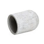 A concrete cylinder with a gray and white speckled texture lies on its side against a plain white background, showcasing a modern design.