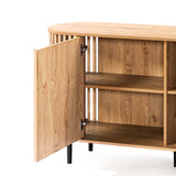 This decorative cabinet features an open door revealing spacious interior shelves. With its light oak wood grain finish and sleek black legs, it embodies a mid-century modern buffet cabinet style.