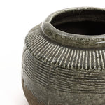 Close-up of a LuxenHome Rustic Brown Stoneware Bowl Vase, showcasing a wide circular opening and textured surface with vertical gray and earthy tones, ideal for adding rustic charm to your home decor.