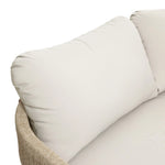 Close-up of a light beige cushioned seat with woven armrest, part of the Rope Sides Loveseat from an Outdoor Acacia Wood Coffee Table Set, showing the backrest and a portion of the seating area.