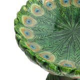 Close-up of an exquisite decorative green dish with a peacock feather design, featuring concentric rings with eye-like patterns. Perfect for adding charm to any outdoor space, this piece also doubles as a stunning Peacock Resin Birdbath.