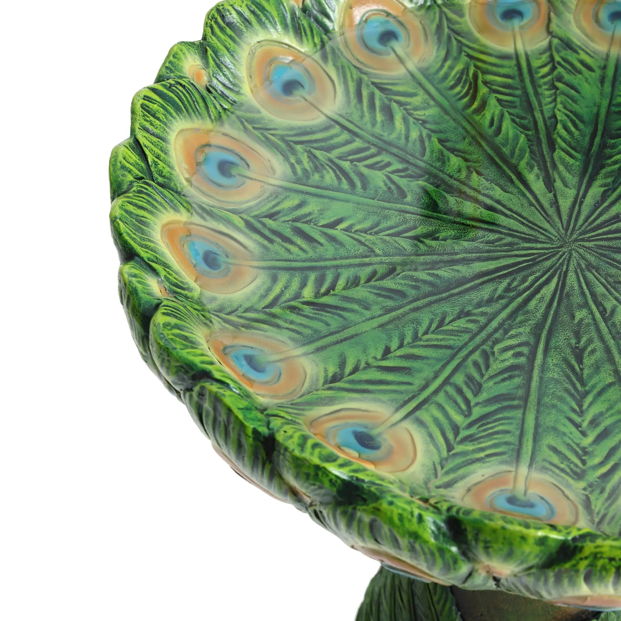 Close-up of an exquisite decorative green dish with a peacock feather design, featuring concentric rings with eye-like patterns. Perfect for adding charm to any outdoor space, this piece also doubles as a stunning Peacock Resin Birdbath.