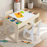 The LuxenHome Drawing and Activity Board Children Table with 2 Chairs Set acts as a versatile piece featuring built-in storage filled with colorful building blocks. It rests on a light brown rug with car and road designs, in a well-lit room.