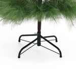 The base and lower branches of an artificial Christmas tree with green needles and a black metal stand add a festive touch to your holiday décor, set against a crisp white background.
