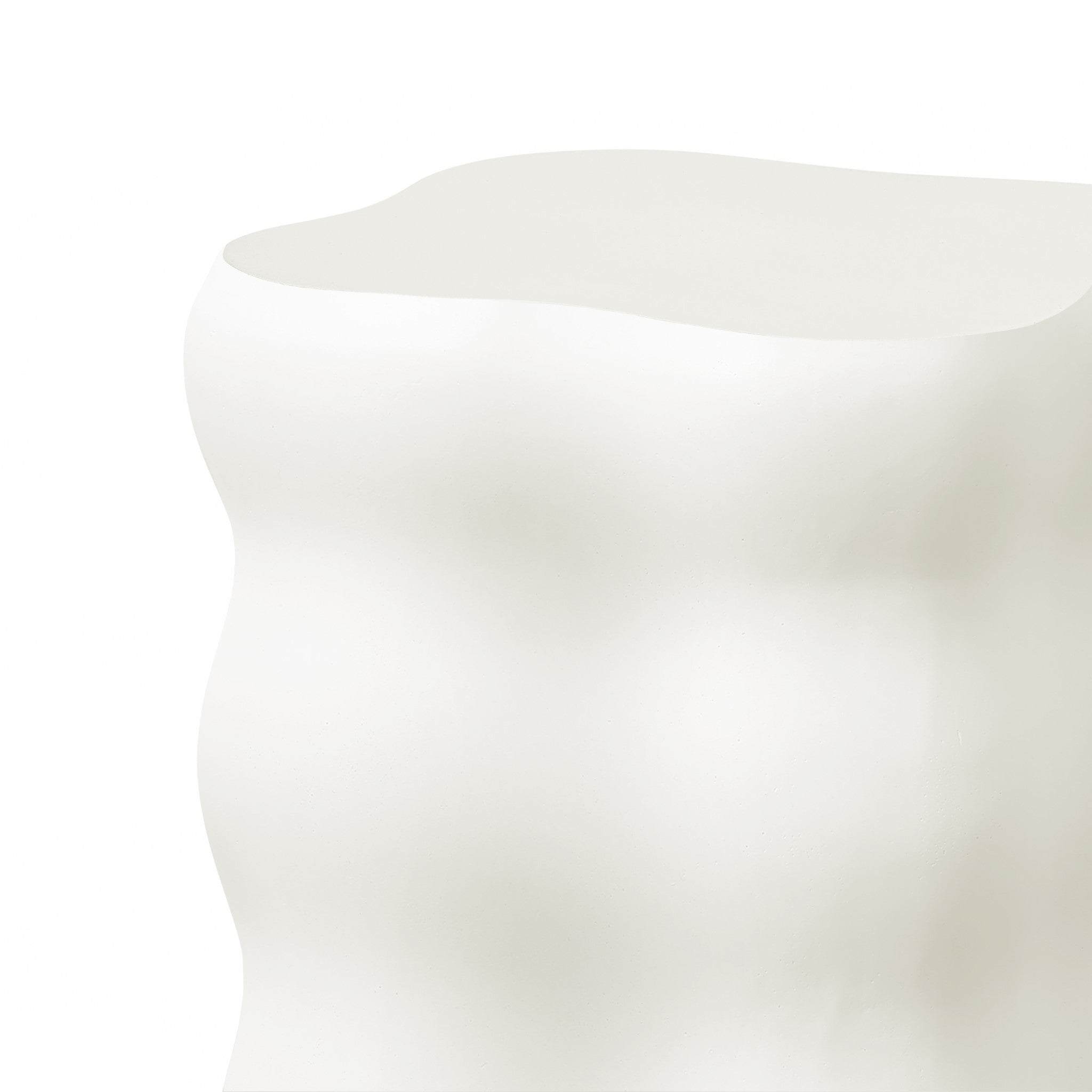Abstract, wavy white sculpture crafted from MgO material with a smooth surface and curvilinear shape, reminiscent of a modern home furnishing, set against a plain background.