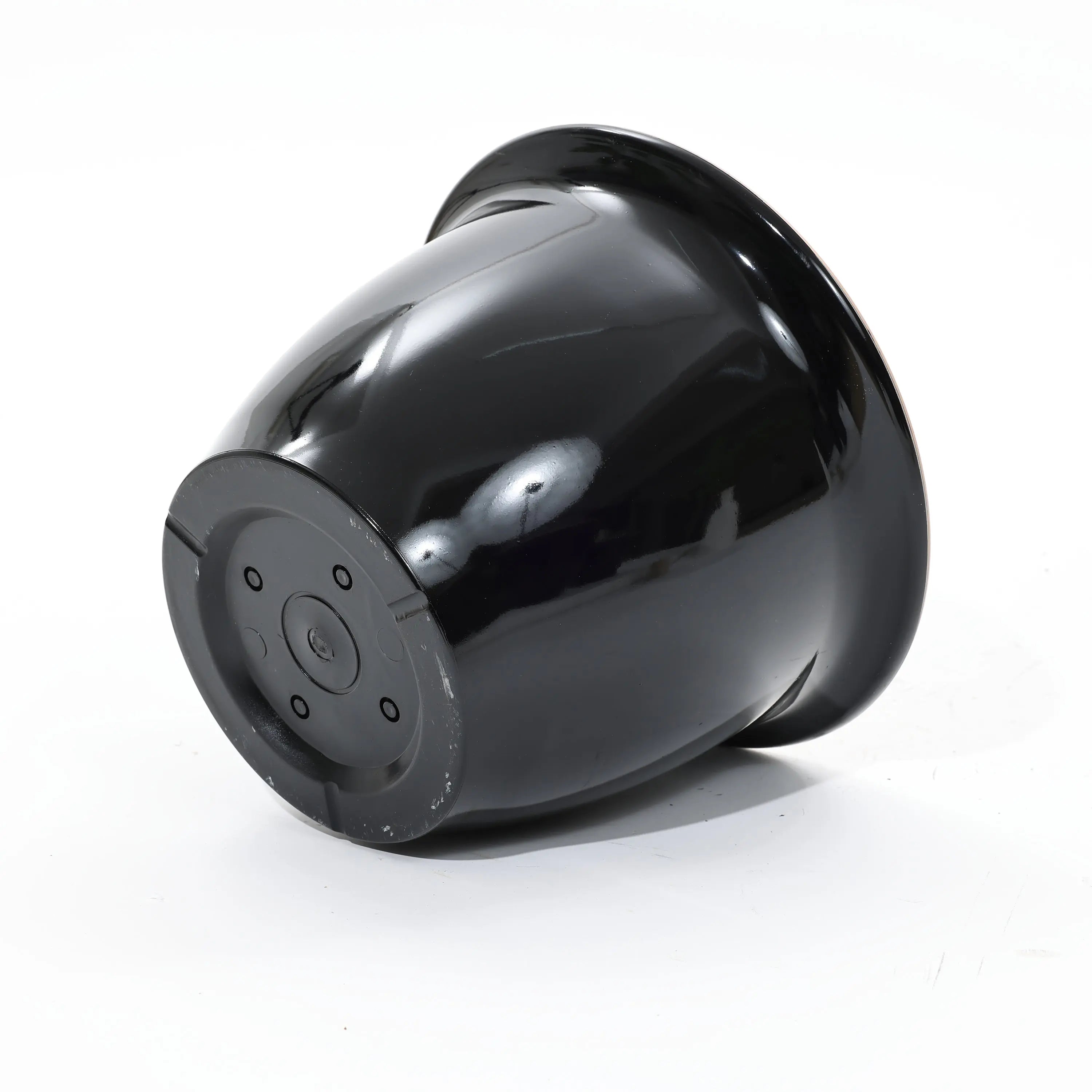 A black plastic flower pot, perfect for indoor and outdoor use, is shown upside down on a white background.