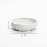 White ceramic bowl with measurements: 3.1 inches tall and 11.2 inches in diameter, perfect as a round bowl vase. Ideal for showcasing floral arrangements indoors and outdoors, blending elegance and versatility seamlessly.