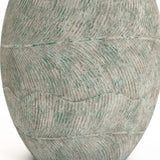 The close-up of the Rustic Multi-Color Cement 15.4-Inch Round Planter by LuxenHome reveals intricate wavy patterns in blue-green and gray hues, with fine grooves creating a flowing, rhythmic design that adds character to any space.
