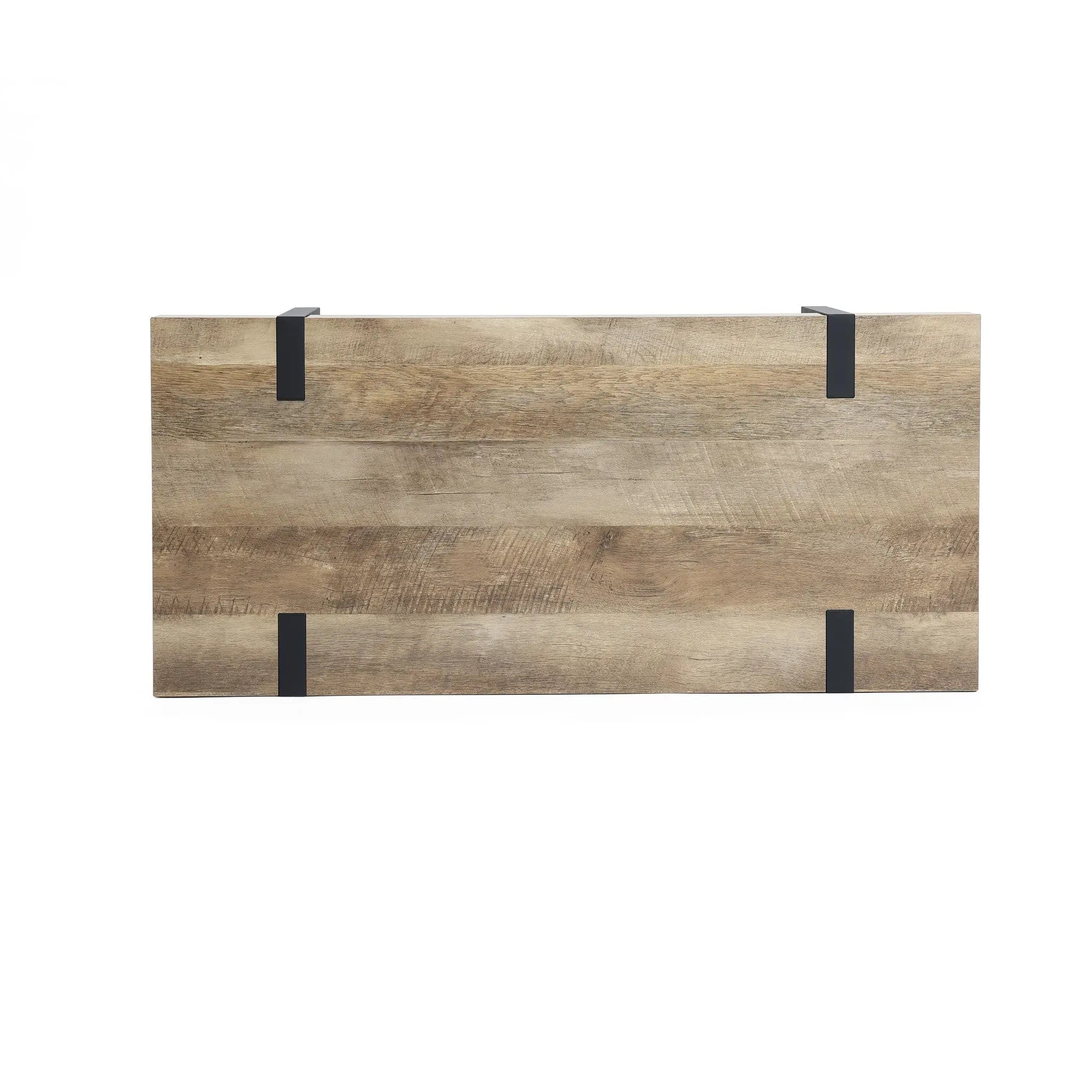 Rectangular wooden tabletop with an oak finish wood and four black metal brackets attached to the edges, photographed on a white background—a modern farmhouse coffee table thats a living room essential.