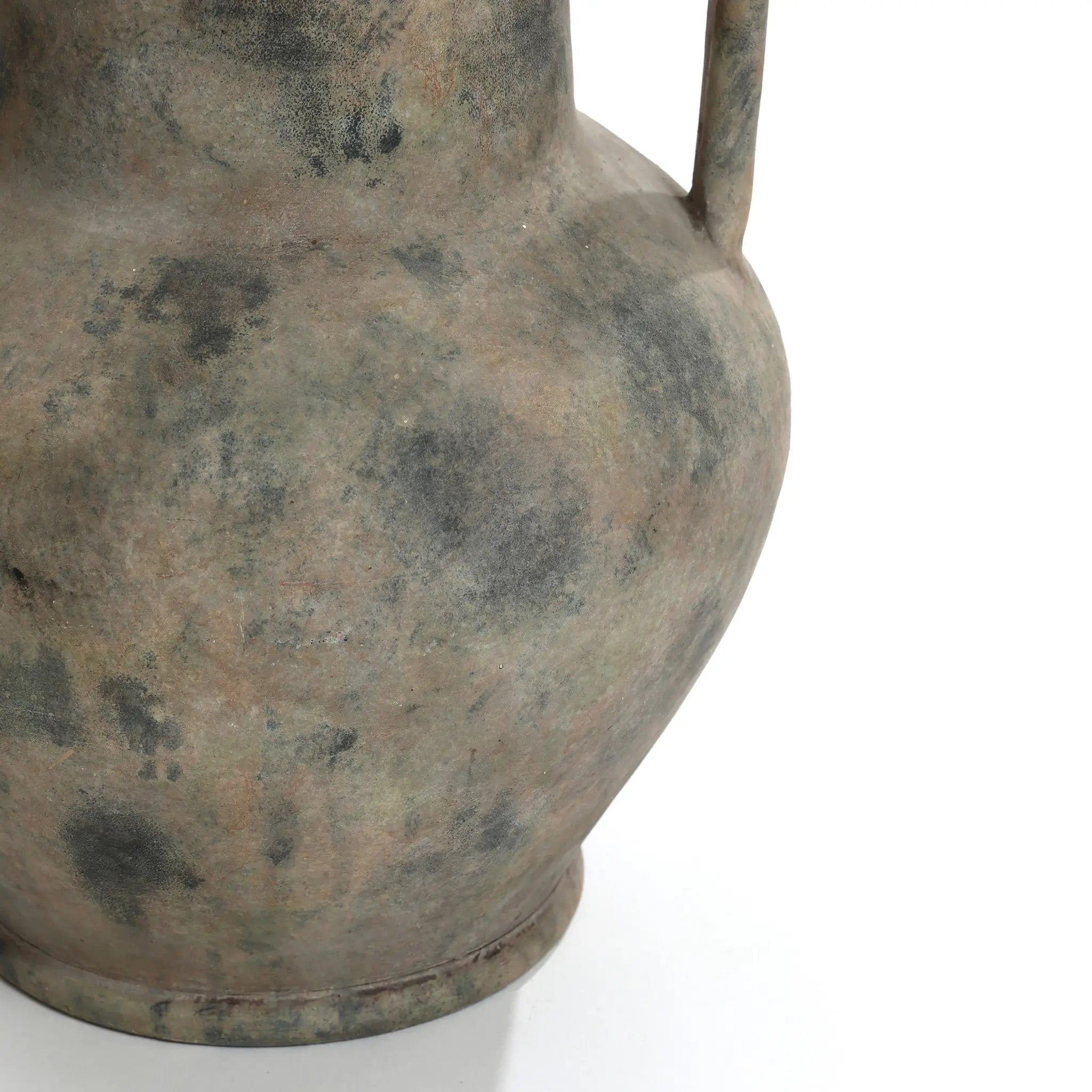A close-up of the LuxenHome Rustic mottled grey terracotta urn vase, 12.1 high, featuring a textured surface and single handle on the right. It displays aged shades of gray and brown against a plain white background.