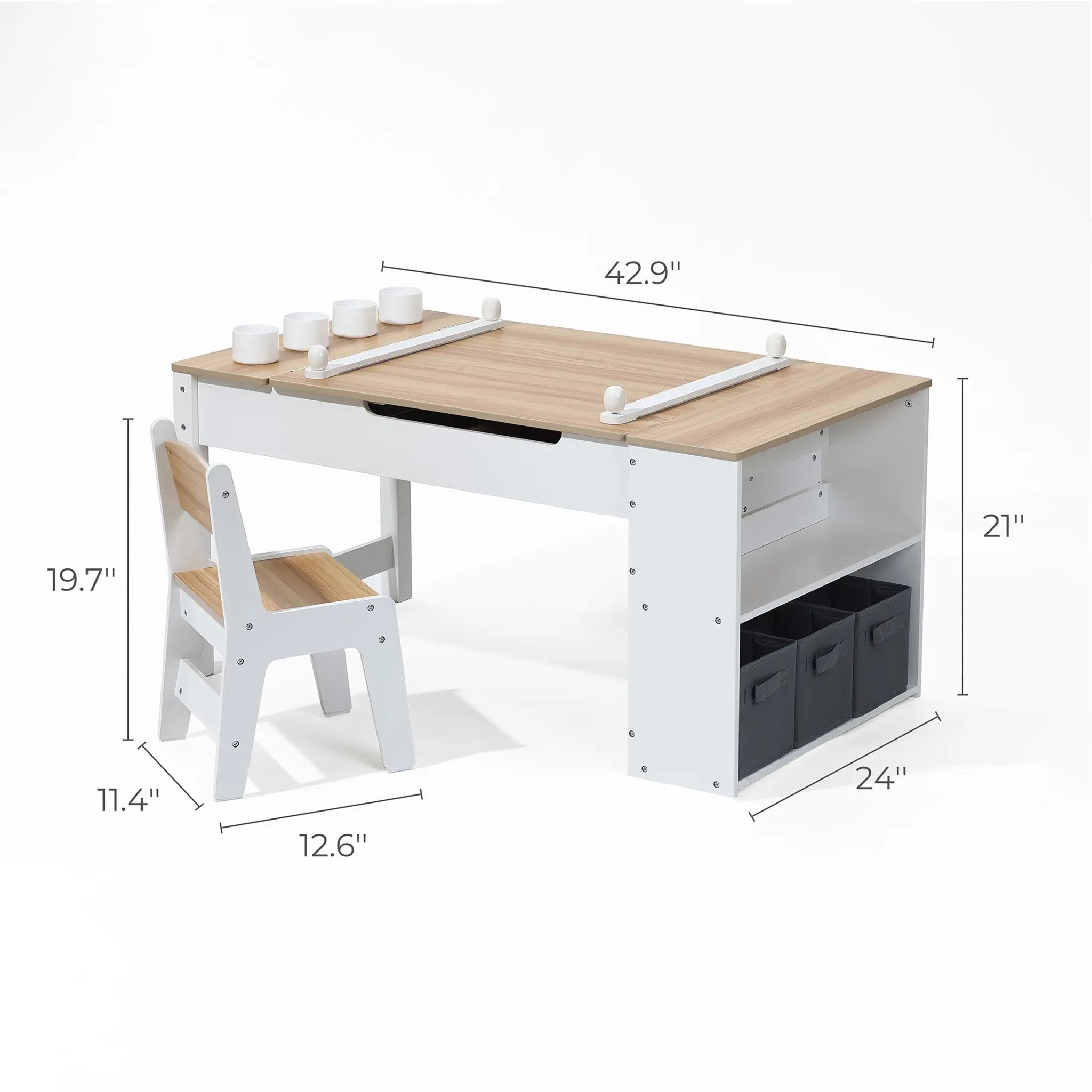 The LuxenHome Activity Children Table with Storage Bookcase and 2 Chairs Set is ideal for creative projects. The desk measures 42.9 W, 21 H, and 24 D with shelves and two black bins. The light wood and white chair is chic, measuring 19.7 H, 11.4 W, and 12.6 D.
.