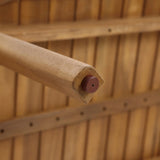 Close-up of the end of a wooden oar with a reddish-brown cap, positioned above the acacia wood planks of a boat interior, evoking the craftsmanship found in an outdoor Acacia Wood Coffee Table Set.