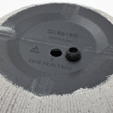 Bottom of a textured planter featuring a modern striped pattern and a marked location to drill a hole, along with the text GL8618B Made in China. Perfect for enhancing your home and garden aesthetic.