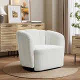 The Amber ivory boucle swivel barrel accent chair by LuxenHome sits elegantly on a round woven rug. A wooden sideboard adorned with framed art, a lamp, and plants enhances the background, while neutral tones create a warm and inviting atmosphere.